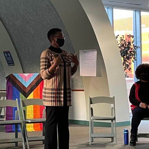 a picture of Center Director Dr. Dawuni speaking to participants at the event